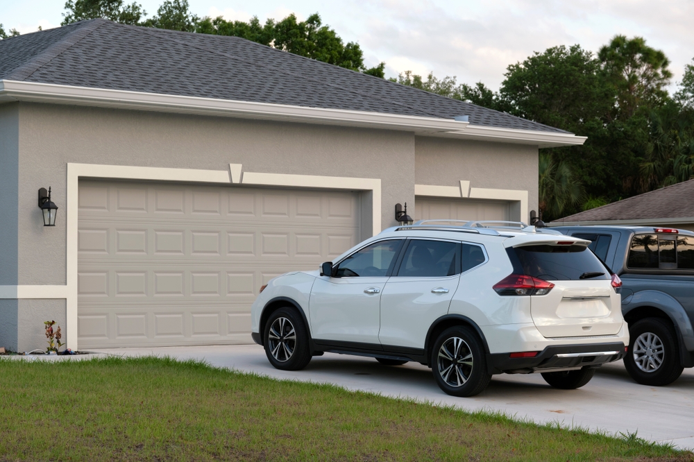 car parked in front of garage.