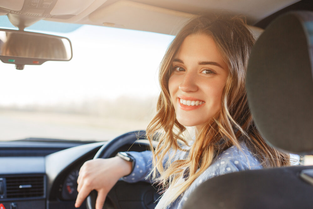 Woman inside her car.