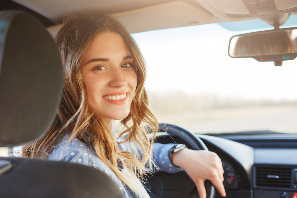 Woman inside her car.