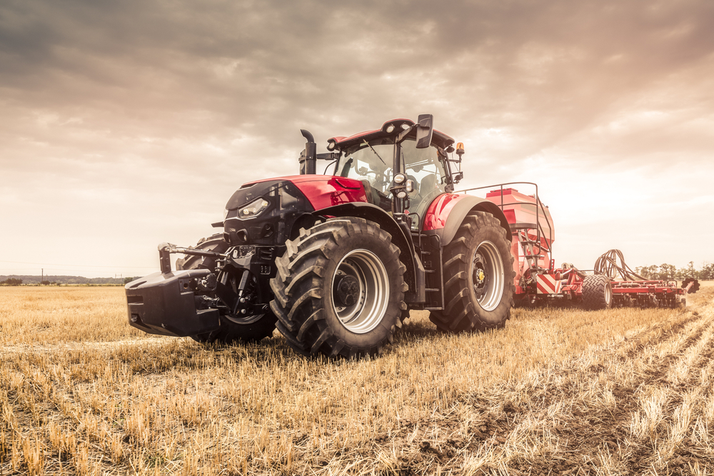 Red tractor on the field.